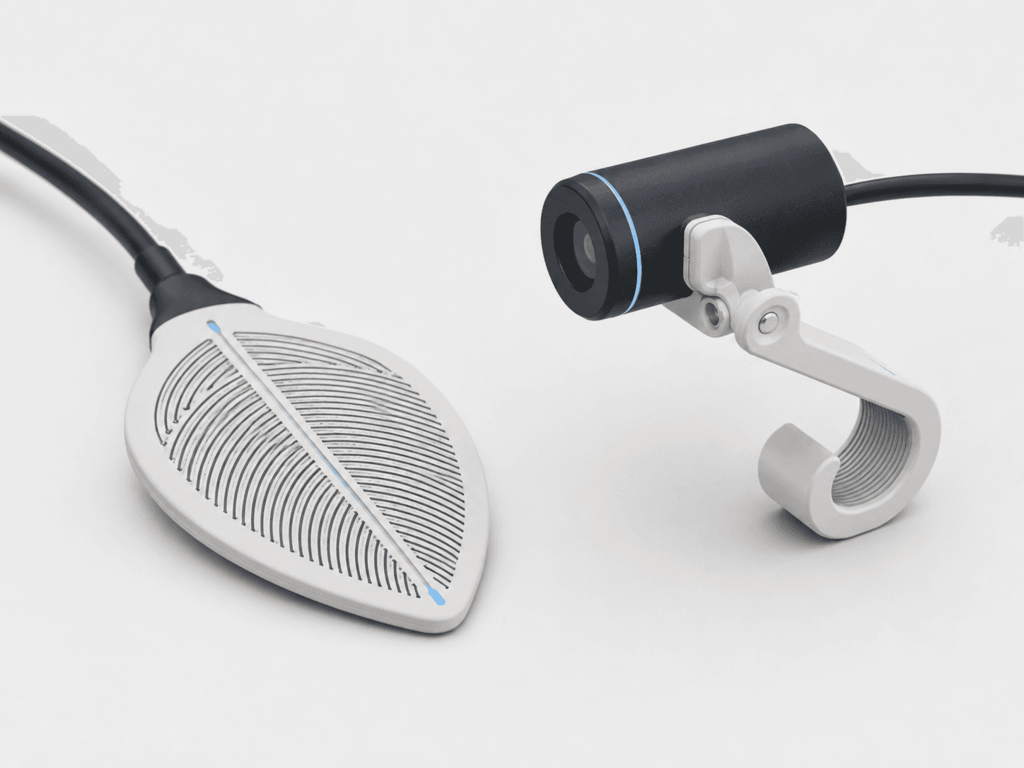 A flat leaf-wetness sensing plate beside a small navy infrared leaf-temperature pod on an adjustable clamp arm.